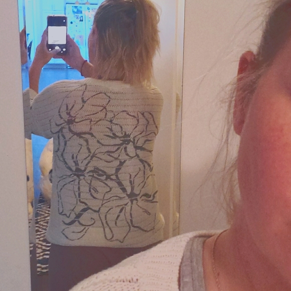 White sweater with Black flower design. - Picture 2 of 4